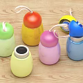 Colorful Stainless Steel Cups With Lanyards On Wooden Table
