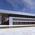 Modern Office Building With Red Brick Exterior Glass Facade And Staircase