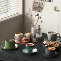 Hot Coffee Beverages In Colorful Mugs With Cookies And Cinnamon Sticks On Kitchen Table