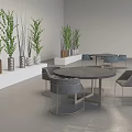 Modern Gray Lounge Chairs With Round Tables Green Plants And White Shelves In Indoor Setting