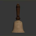 Vintage Brass Bell With Polished Wooden Handle On Reflective Black Surface