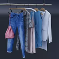 Various Stylish Clothes Hanging on Hangers with Denim and Patterned Designs