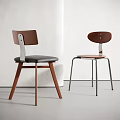 Modern Leisure Chairs with Wooden Back Metal Frame and Black Brown Cushions in Minimalist Interior