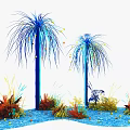 Floral Display Featuring Blue Palm Like Plants Colorful Grasses And Blue Water Surface