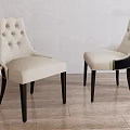 Pair of Beige Tufted Leisure Chairs With Curved Back Design And Black Wooden Legs