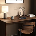 Wooden Desk Setup With Table Lamp Books Chair And Framed Artwork By Window With Blinds