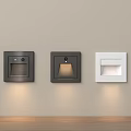 Modern Wall Lamps In Black And White Designs Mounted On Beige Wall