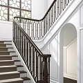 Elegant Staircase With Dark Metal Railing Geometric Design White Wainscoting Walls And Arched Doorway