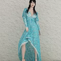Woman in Blue Long Dress With Long Sleeves V Neck Lace Asymmetrical Hem Light Wall
