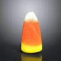 Stone And Wood Decorative Cone Shaped Object With Yellow Orange White Tones On Black Reflective Surface