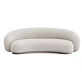 Modern Curved Light Colored Multi Person Sofa With Soft Velvet Upholstery And Elegant Design
