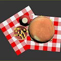 Delicious Hamburger with French Fries and Red Soda on Checkered Napkin