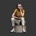 Woman In Yellow Top Sitting On Round Stool With White Pants And Reflective Floor