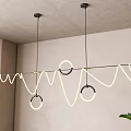 Modern Wavy Line Chandelier With Circular Rings Illuminated By LED In Minimalist Interior Space