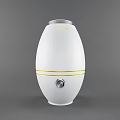 White Oval Daily Use Electric Humidifier With Yellow Stripes And Control Knob Design