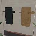 Black And Gold Decorative Door Knockers With Carved Patterns On Wall And Green Plants