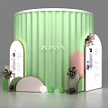 Green Cylindrical ZONYA Booth Featuring Arched Display Boards Product Images Text Plants And Circular Decorations