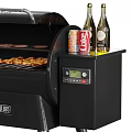 Black Outdoor Grill With Grilled Food Bottles And Hanging Tools Setup