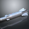 Silver Military Missile Weapon With Fins Nose Cone And Metallic Surface