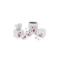 White Bathroom Essentials With Red Floral Patterns Including Soap Dispenser Toothbrush Holder And Tissue Box