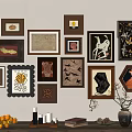 Stylish Photo Wall With Various Shaped Frames Artworks And Tabletop Oranges Candles Books Vase