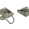 Two Vintage Telephones With Keypad And Coiled Cord On White Background