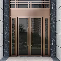 Modern Bronze Swing Door With Glass Panels And Marble Wall Surroundings