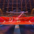 Grand Conference Venue With Red Stage Film Elements And Seats