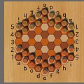 Hexagonal Board Game With Orange Beige Grid And Letters Numbers Markers