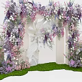 Floral Decorated Event Entrance Arch With Purple Pink Flowers And Green Grass