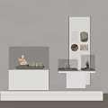 Museum Exhibition Display Featuring White Pedestals Glass Cases Small Sculptures And Information Panel