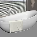 White Freestanding Bathtub With Faucet And Light Colored Towel By Window With Blinds