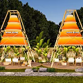 Camping Campsite With Orange Tents Sunny Fun Green Plants White Chairs Wooden Deck And Lawn