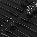 Office Appliances Black Plugs And Various Types Of Cables For Connection Use