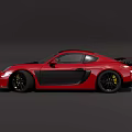 Red Two Door Sports Car With Black Side Panels And Yellow Rims