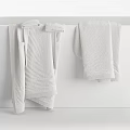 Elegant Modern White Bathtub With White Gray And Beige Towels Hanging