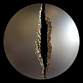 Round Mirror With Vertical Crack In The Middle And Golden Decorative Edges