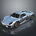 Silver Sleek Sports Car With Green Alloy Wheels On Reflective Surface