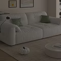 Modern White Plush Sofa Set with Coffee Table and Green Pillows in Living Room