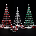 Three Festive Christmas Trees Decorated With Red Green Ornaments And Gift Boxes
