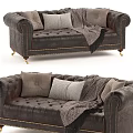 Brown Leather Two Seater Sofa With Tufted Design Brass Legs Throw Pillows And Blanket