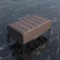 Elegant Brown Tufted Ottoman With Stylish Black Metal Legs On Marble Floor