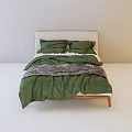 Minimalist Double Bed With Light Green Quilt Gray Blanket Pillows And Wooden Frame