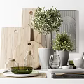Natural Style Kitchen Utensils With Wooden Cutting Boards Olive Oil Bottles And Green Plants