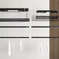 Black Wall Shelves And Hanging Rods With White Towels In Modern Interior
