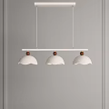 Three White Pendant Lights With Brown Wooden Accents Hanging Against Gray Wall