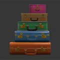 Colorful Stacked Suitcases with Gold Accents Handles and Reflective Surface on Dark Background