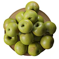 Pile of Fresh Green Apples on a Plate with Scattered Ones Around