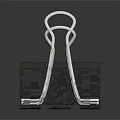 Silver Metal Paper Clip With Black Base And Reflective Surface For Office Use