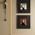 Stylish Abstract Portrait Paintings With Black Frames Hung On Beige Wall 3d model